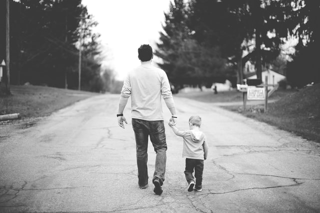 black and white photo of father and son